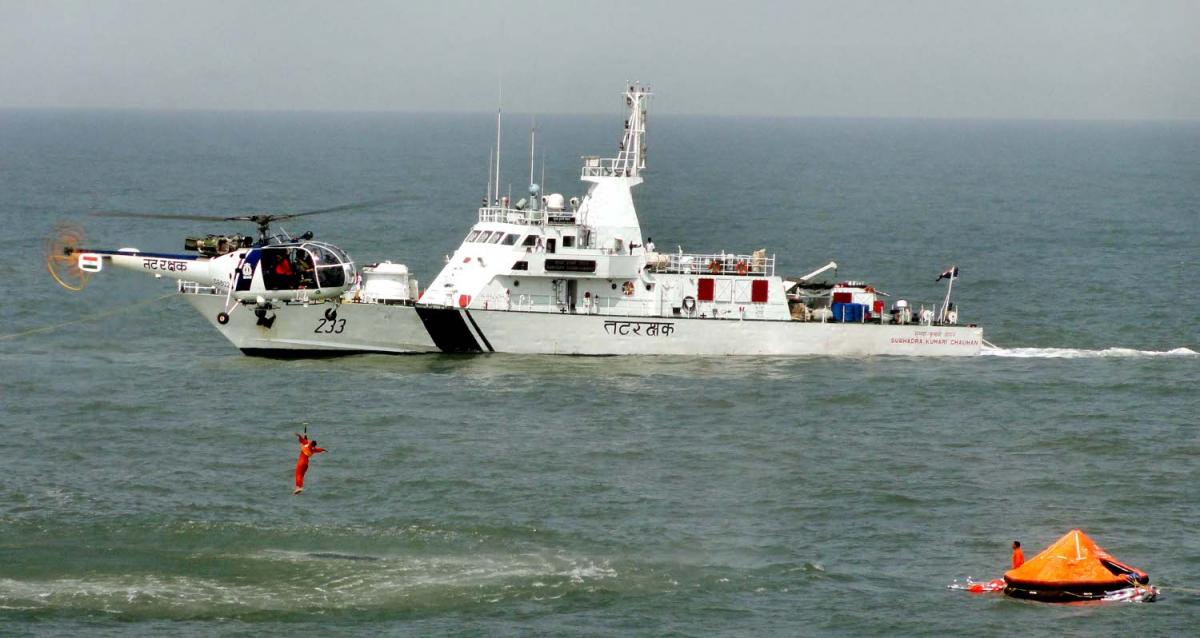 Indian Coast Guard (ICG) helicopter takes a survivor to an ICG ship during a mock drill.