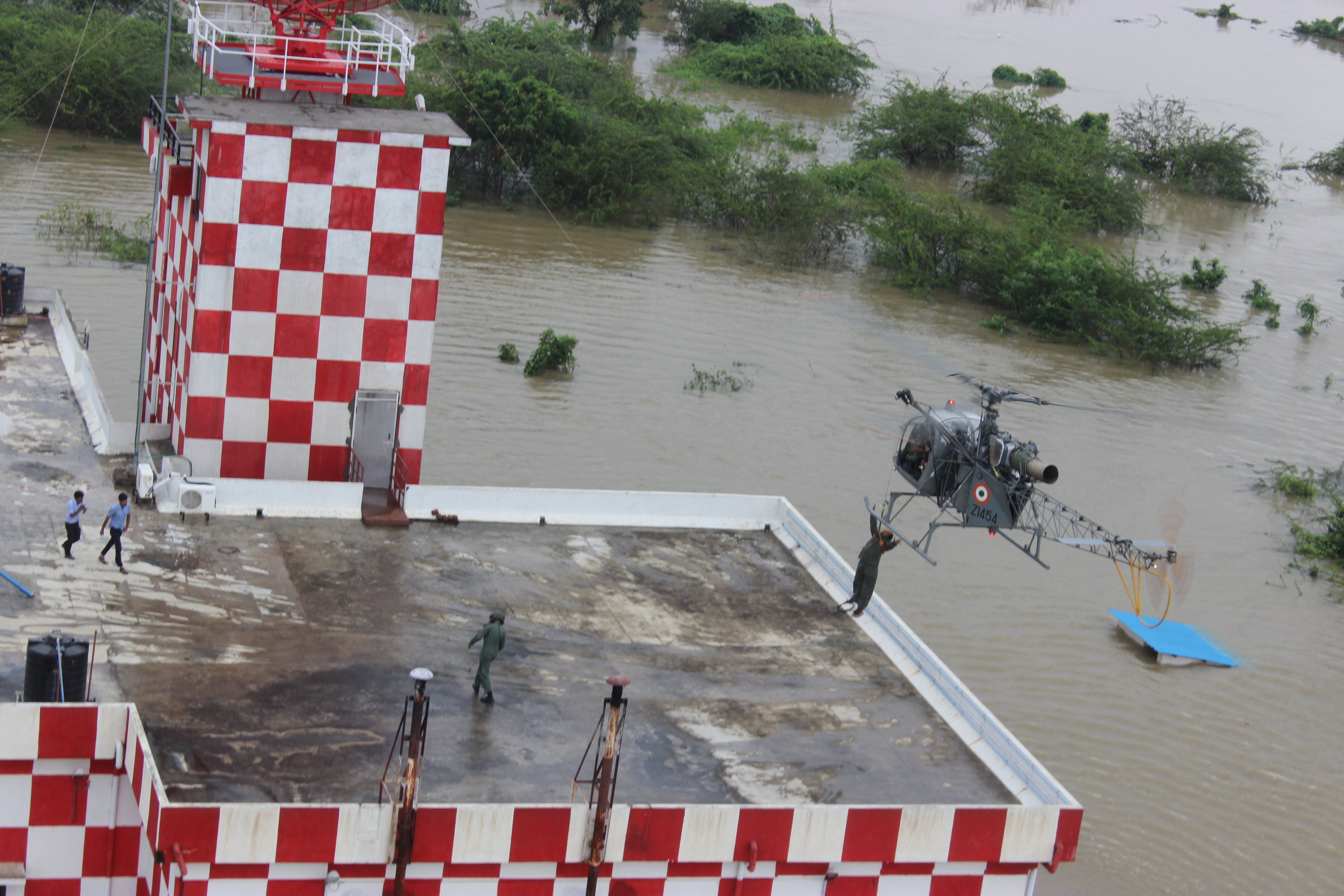 An Indian Air Force helicopter rescues stranded people during 2015 Chennai Floods.
